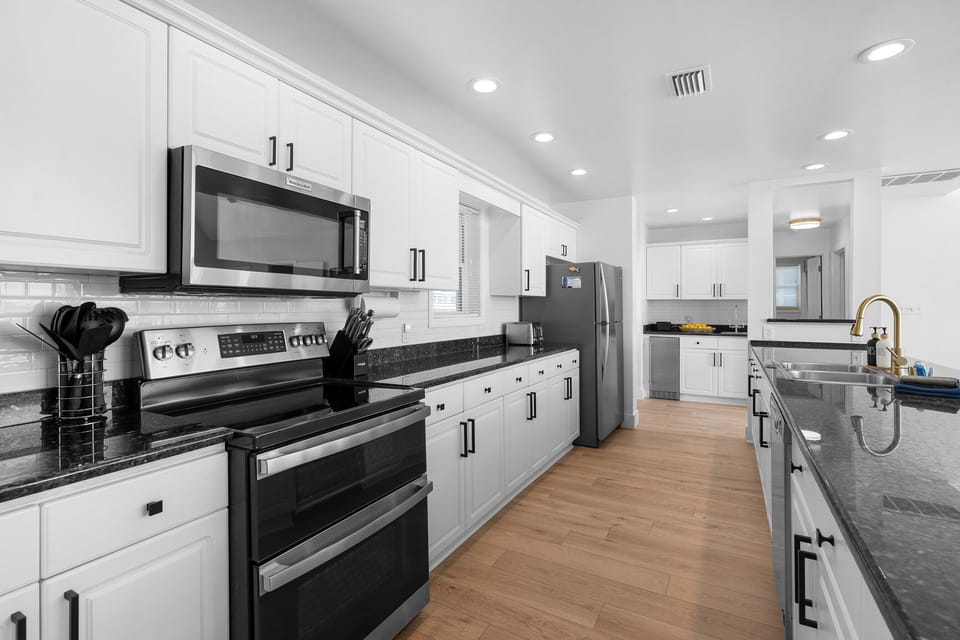 Chef's dream kitchen with a 5 burner range and a double oven