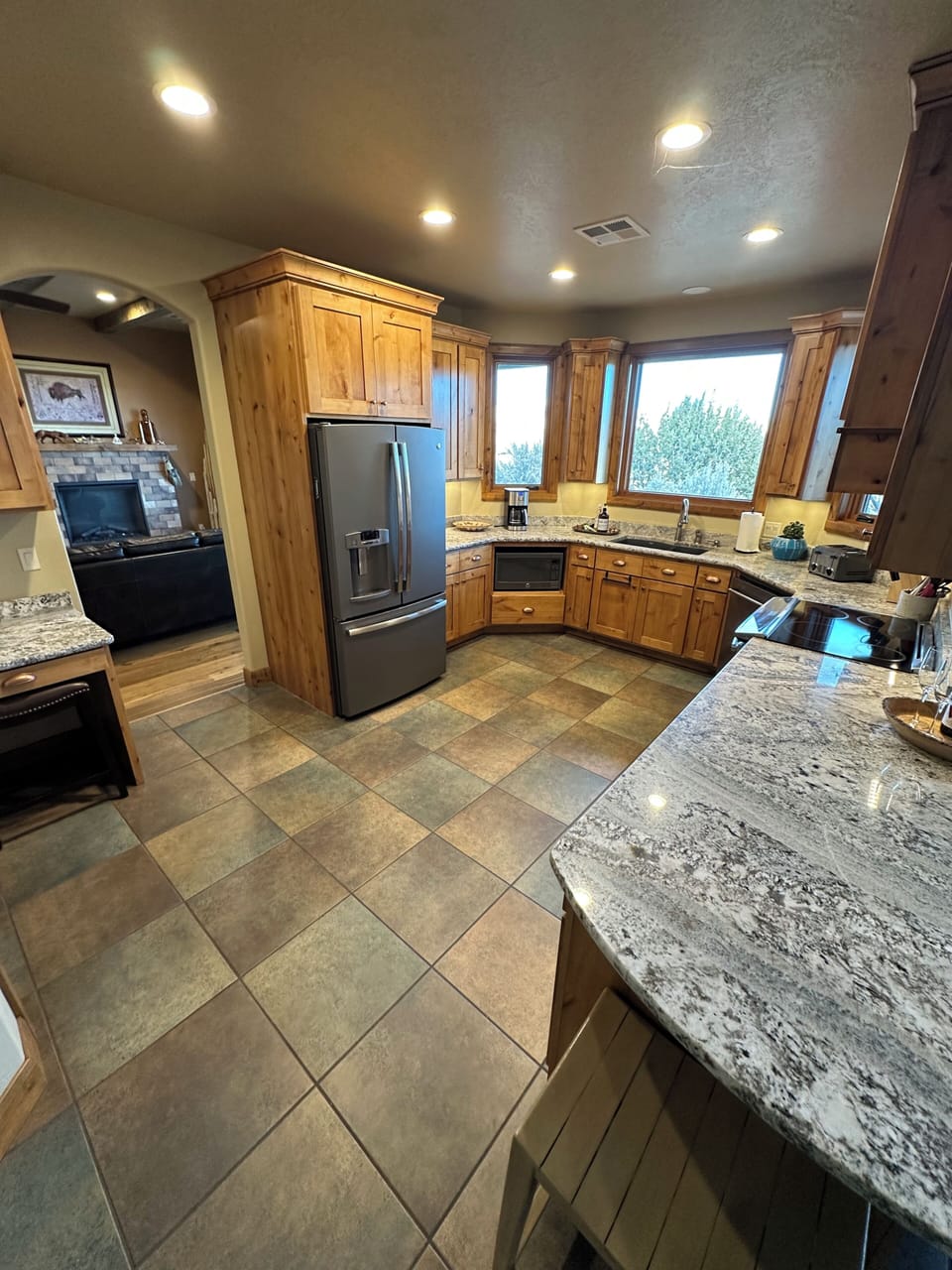 Fully stocked kitchen with induction stove. 