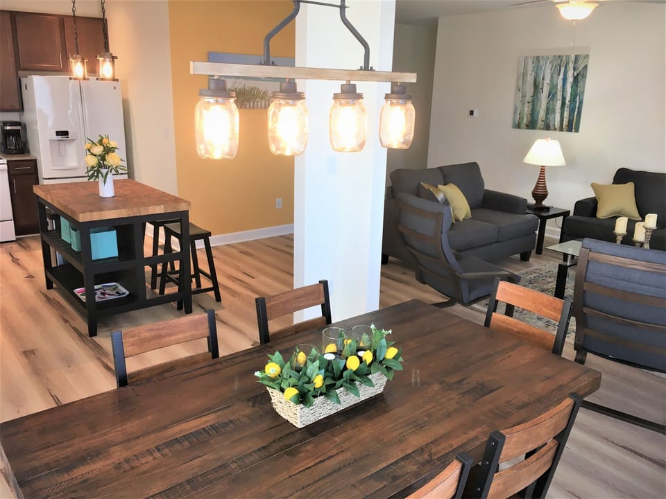 Dining table seats 8 comfortably, and 10 w/ 2 additional folding chairs