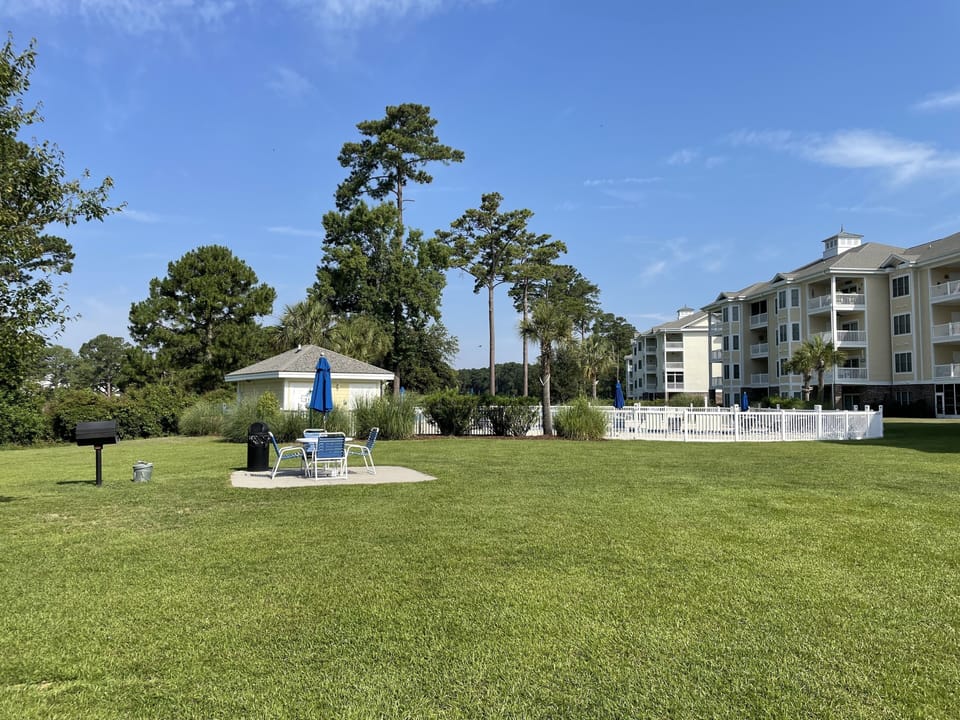 View of BBQ area and 1 of 7 pools