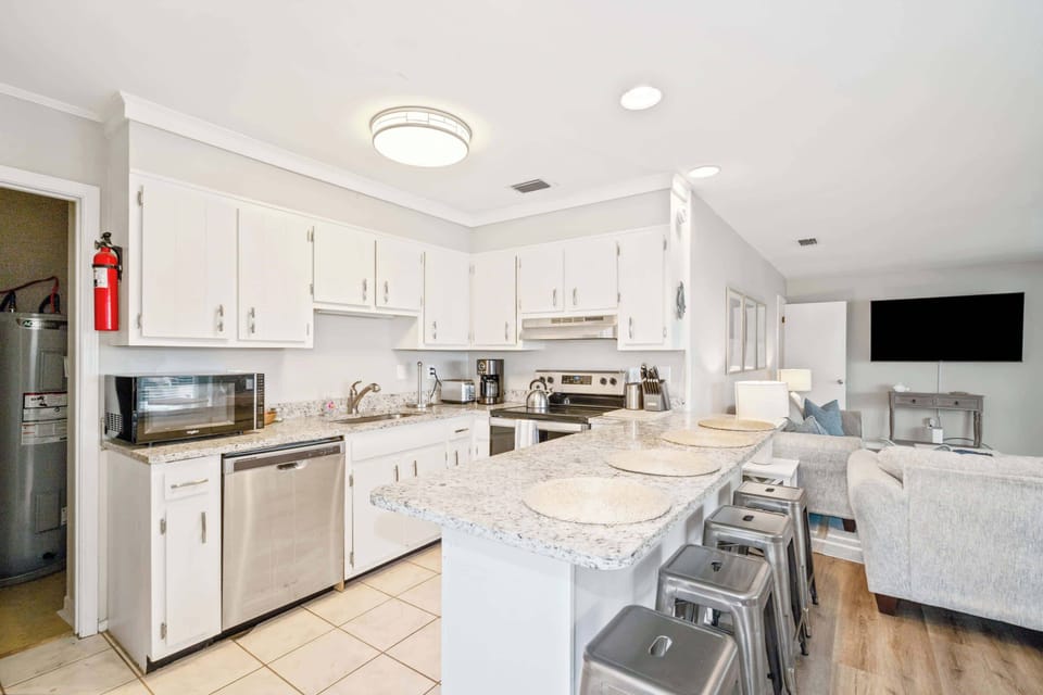 Fully equipped kitchen and bar seating