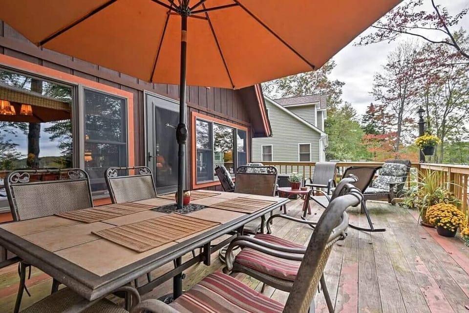 Deck overlooking backyard and lake