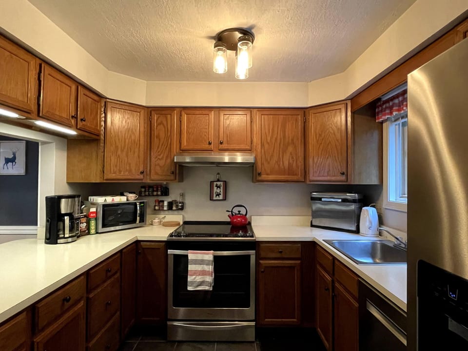 Kitchen stainless-steel appliances and is fully-equipped for cooking.