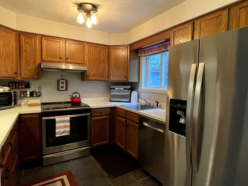 Kitchen stainless-steel appliances and is fully-equipped for cooking.