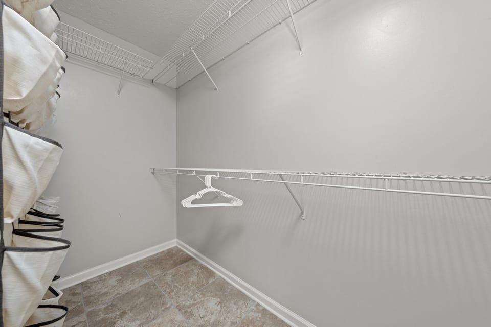 Walk-in master bedroom closet.