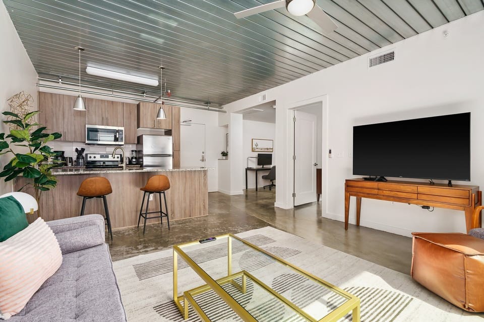 Cozy up and enjoy the smart TV in this comfortable living space.