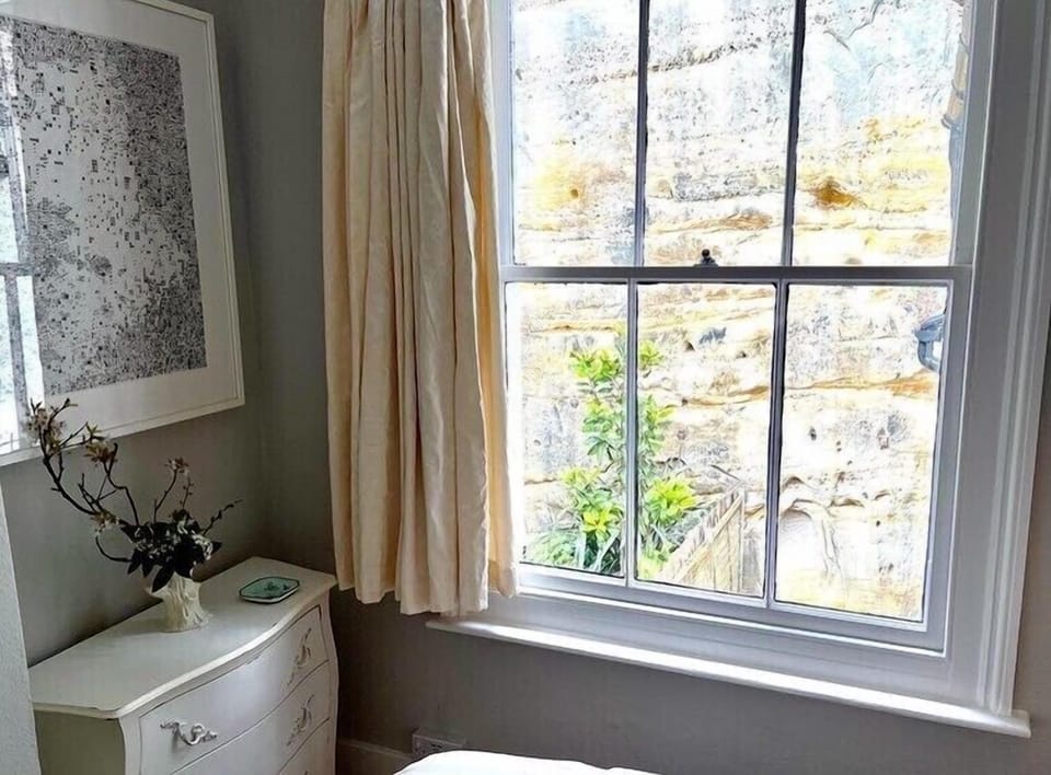 Second bedroom with garden & cliff view
