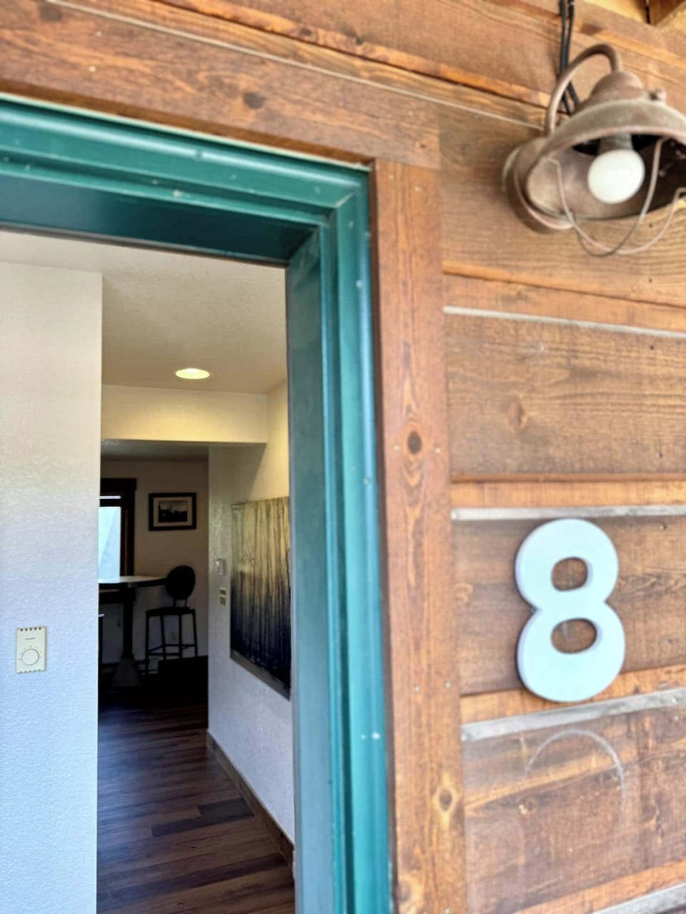 The Loose Moose Lodge offers stunning curb appeal with its charming rustic exterior, surrounded by the natural beauty of Grand Lake. Enjoy the peaceful mountain surroundings right at your doorstep.