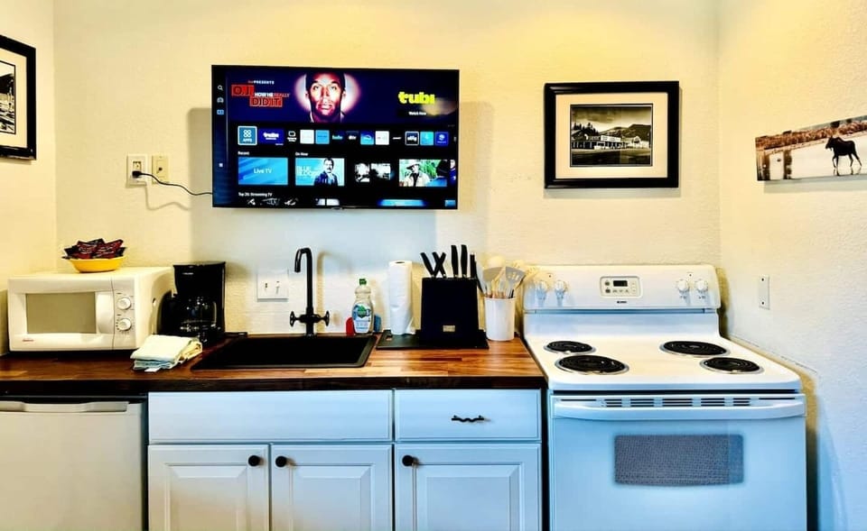 This fully equipped kitchen offers stainless steel appliances, a spacious island, and ample storage. Perfect for cooking up meals while taking in the beauty of Grand Lake during your stay.
