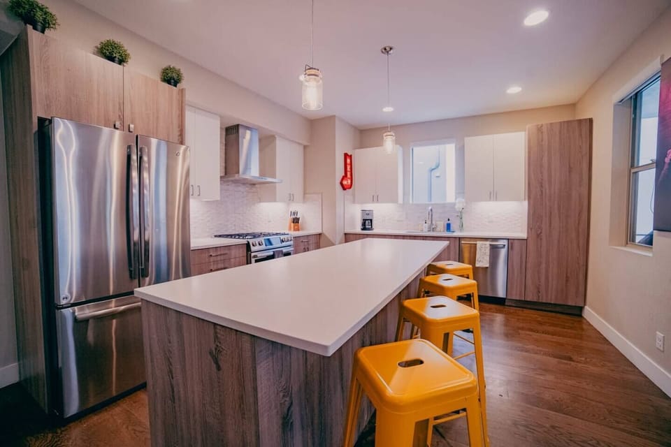 Modern culinary haven: Whip up your favorite recipes in the contemporary kitchen of this Denver apartment, blending comfort and urban living seamlessly.