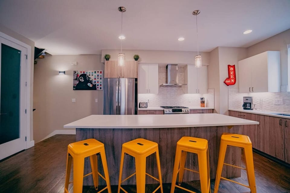 City living, gourmet style: Discover the joy of cooking in this Denver apartment kitchen, a harmonious blend of sophistication and practicality.