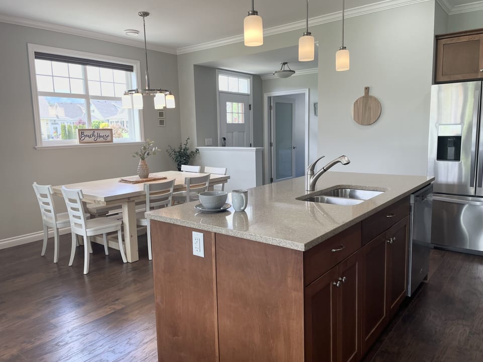 Open concept kitchen, dining & living room. 