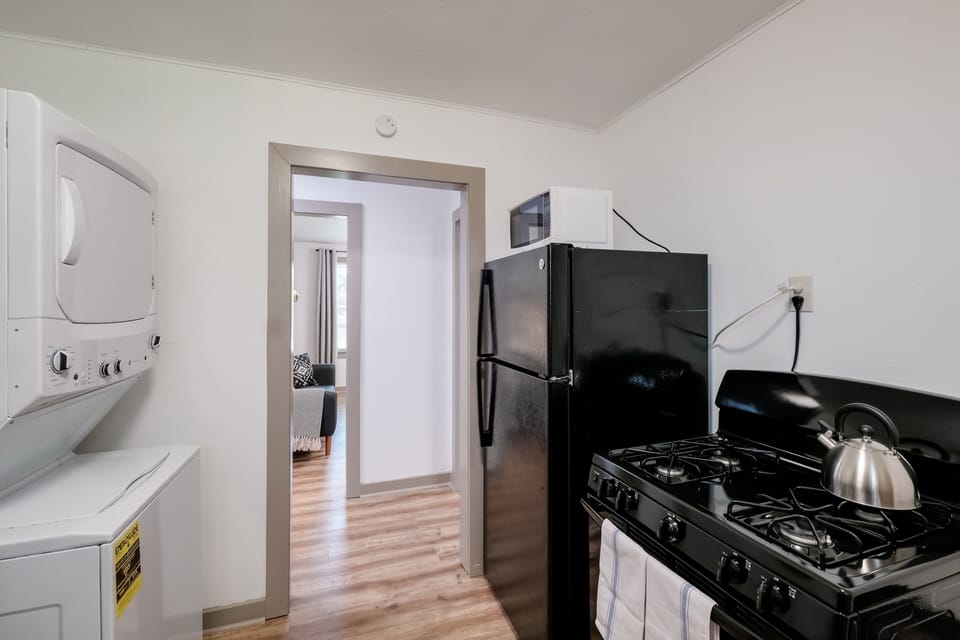Spacious kitchen area where you can cook meals while staying in the unit. 
