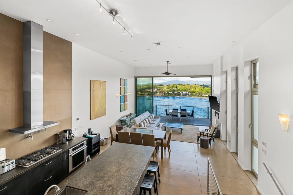 Beautiful designer kitchen open to dining, living room, deck and ocean view!