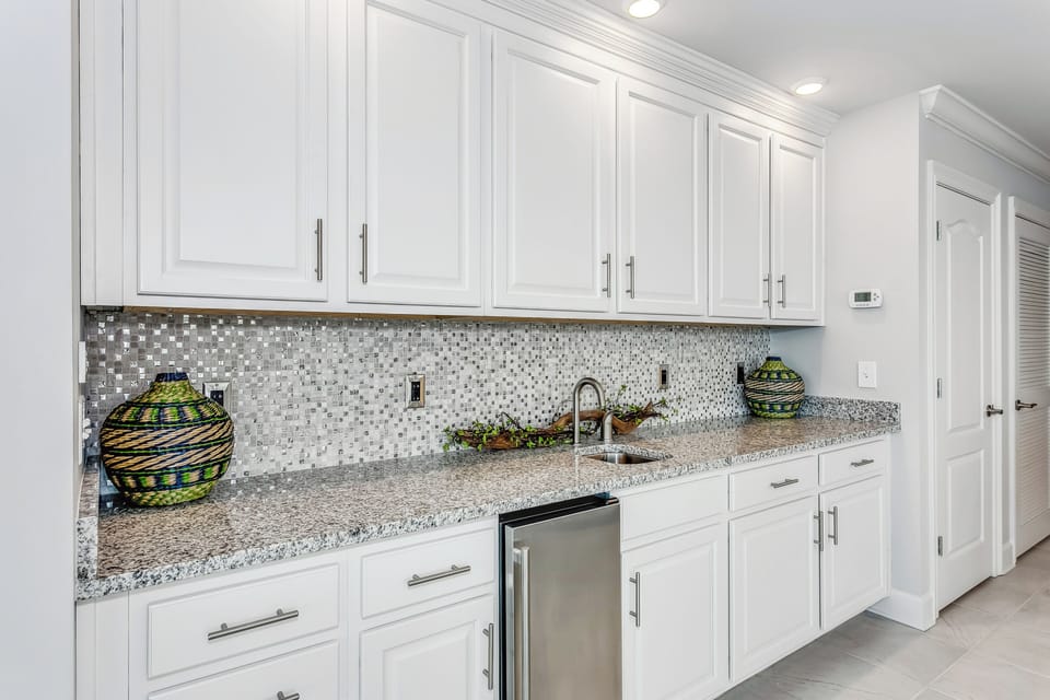 Wet bar with wine/liquor specific glassware. 