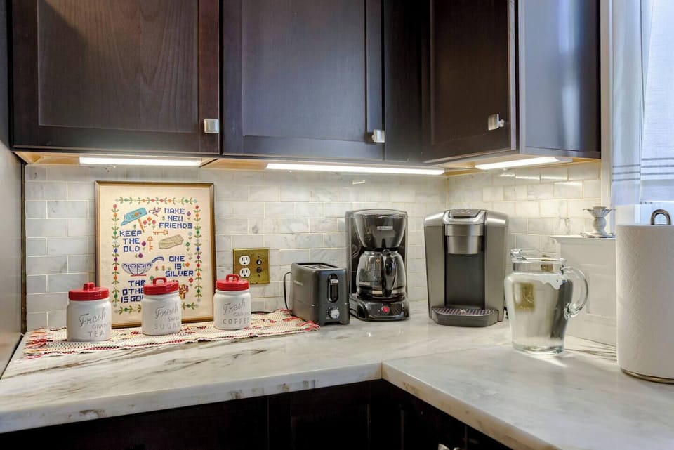 Coffee bar with both drip and Keurig coffee makers.