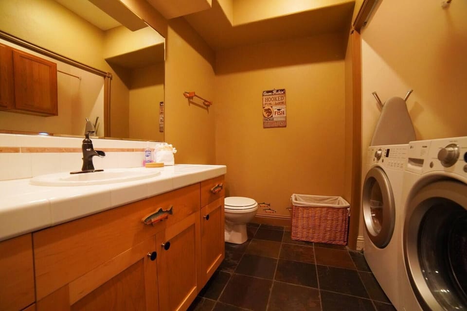 The 1st floor powder room is also home to the washer/dryer — we even provide detergent!