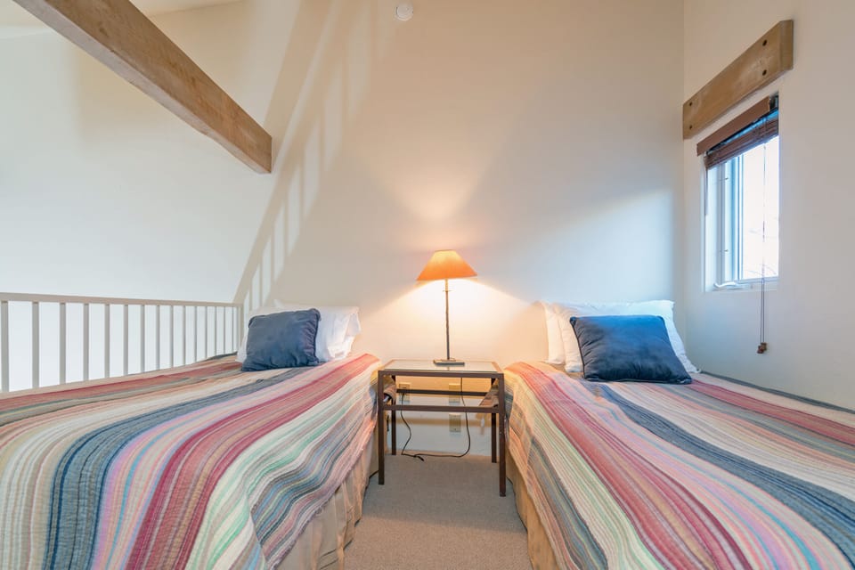 The loft features two twin beds.