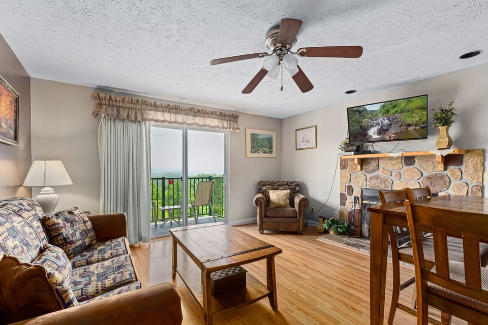 Living Area - Balcony Access + Fireplace