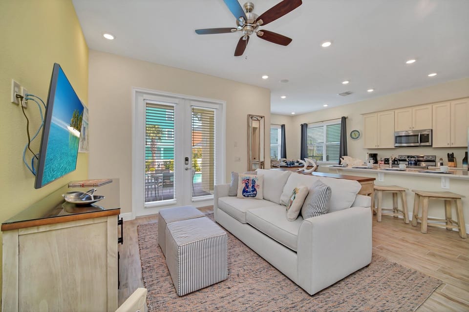 - Spacious living area of the cottage in Reunion Florida - Designed for comfort and entertainment - Your relaxation haven awaits - Smart TV and Netflix - Thoughtful mix of textures, from plush rugs to tasteful throw pillows