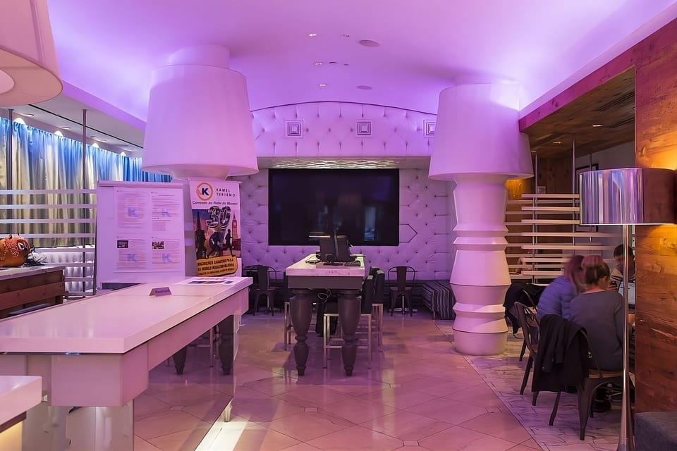 Gather in the vibrant lobby lounge with playful designer lighting.