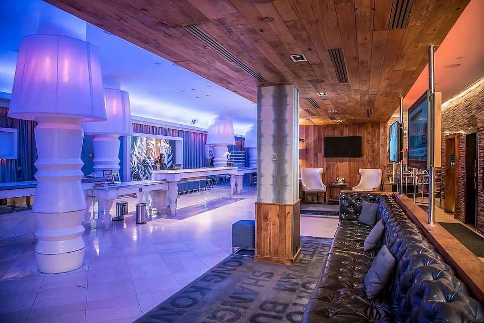 Unwind on plush leather seating under glowing ambient lights.