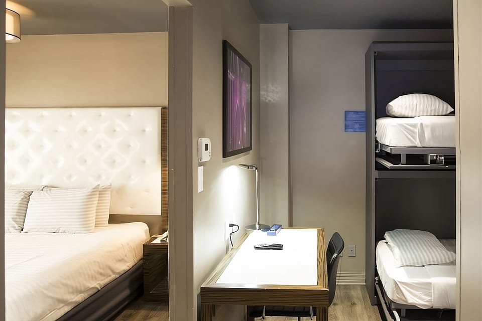 Unwind in a bright room with comfy beds and desk.