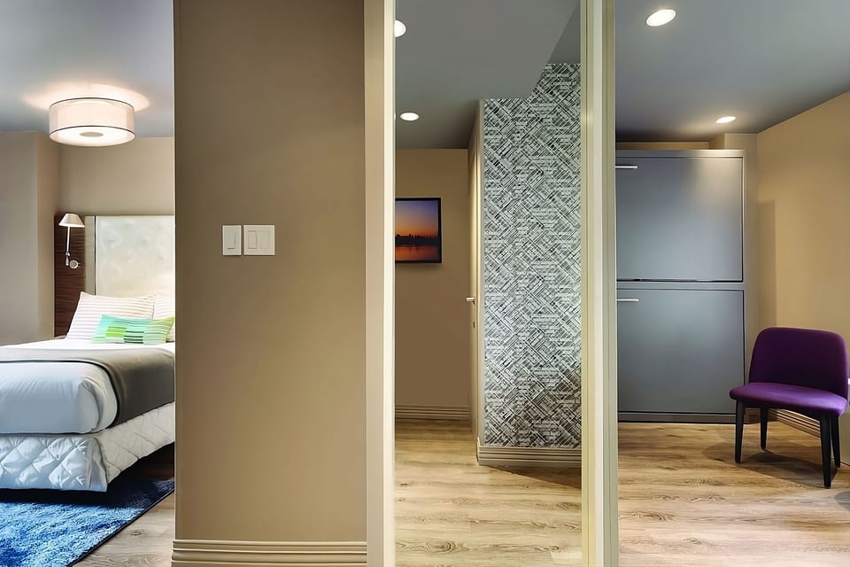 Enjoy skyline mornings from bed in a sunlit corner room.
