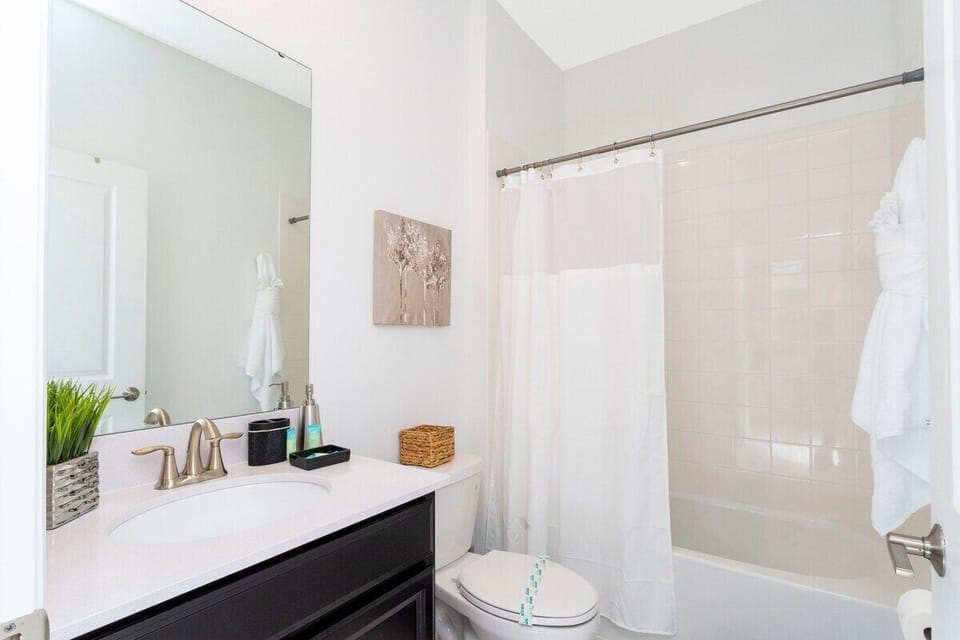 Beautifully designed, bright and inviting bathroom space that exudes a blend of modern elegance and cozy comfort.