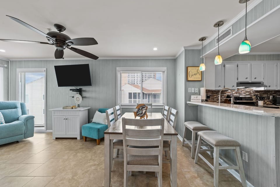 Dining area includes 2 comfortable bar stools for bar access