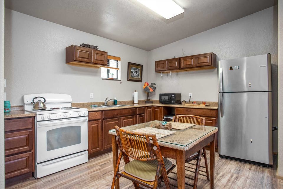 Your country kitchen comes complete with a fridge, oven and range top, microwave, and even complimentary coffee!