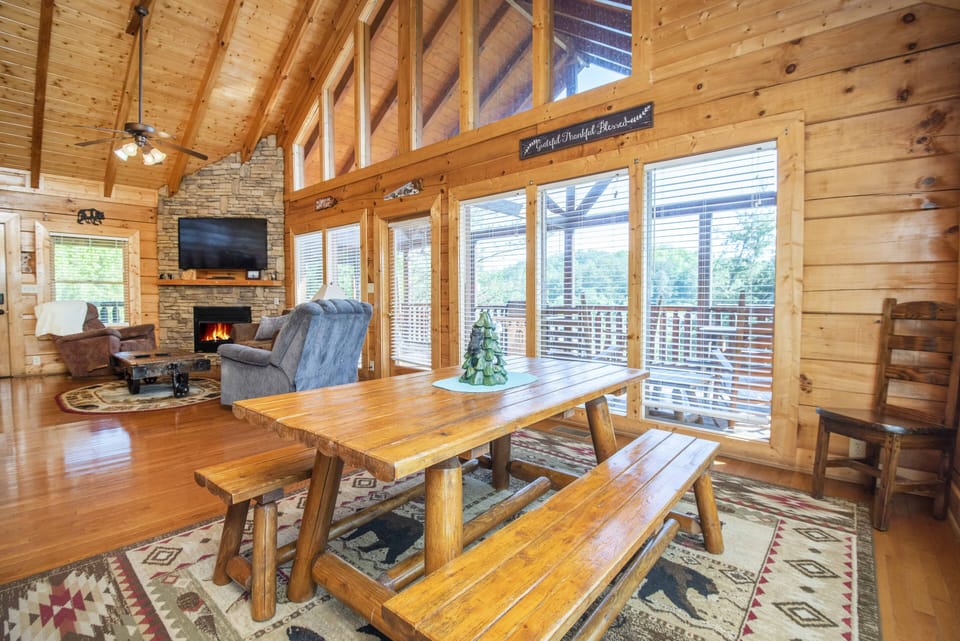 Spacious dining area open to the living room with beautiful cabin views.