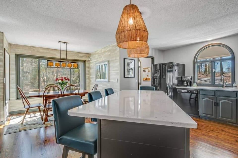 Adjacent to the dining area, the kitchen facilitates seamless meal service.