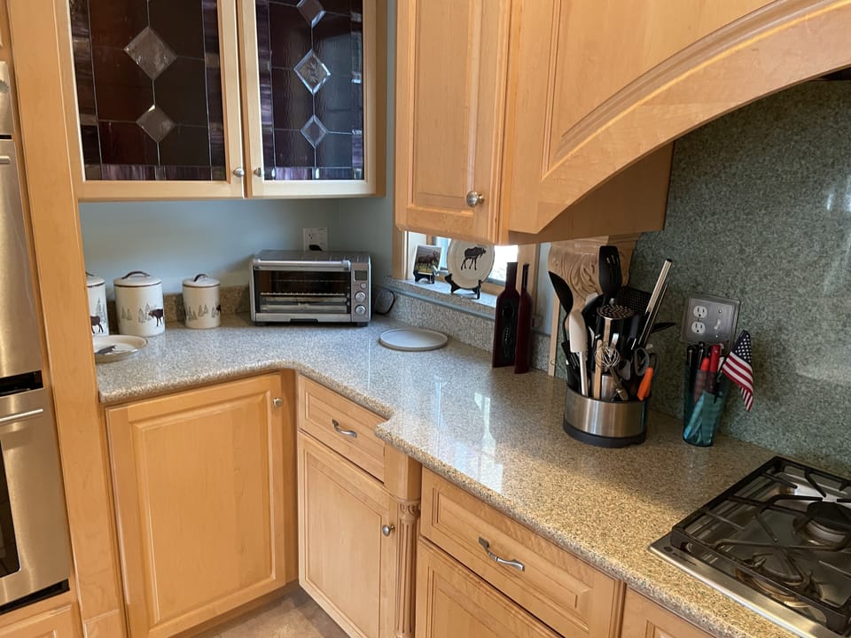 Kitchen is fully equipped for family meals. 