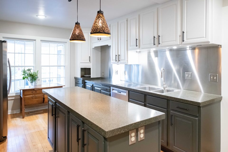 The kitchen is just off the living area and completely updated with commercial stainless appliances.