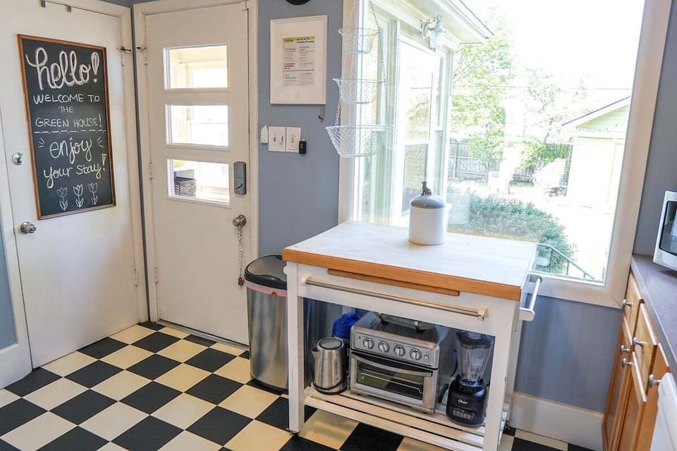 The checkerboard kitchen has everything you need: all appliances, dishes, pots/pans, utensils and all.