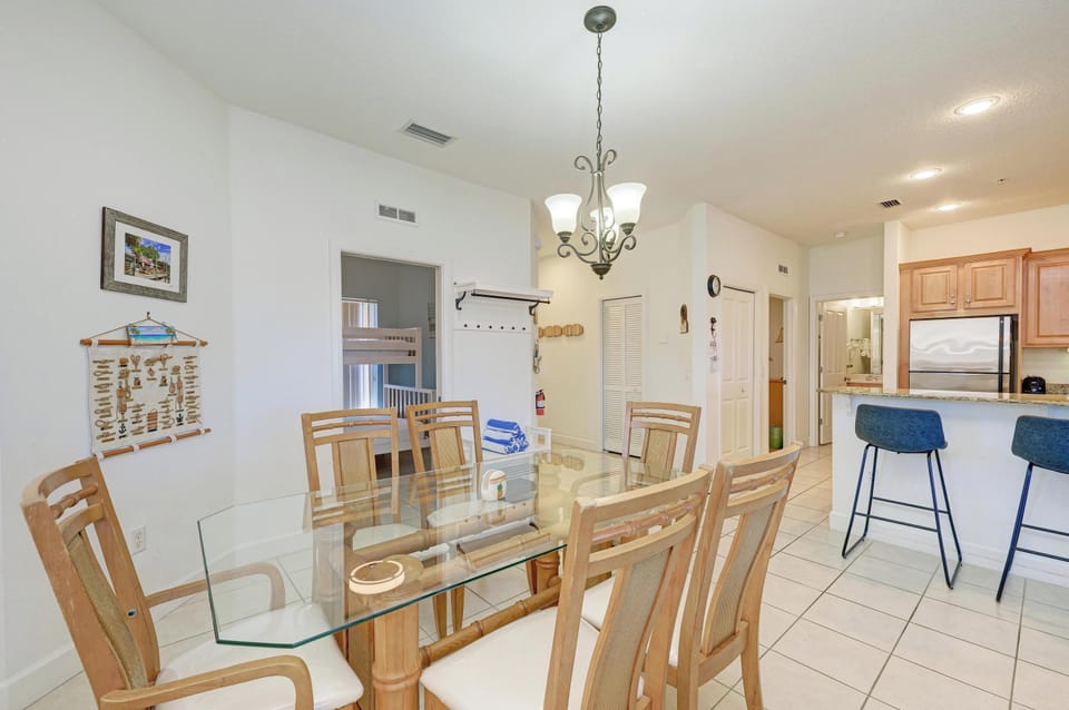Gather around your spacious glass dining table for memorable meals with loved ones in this bright, open-concept space.