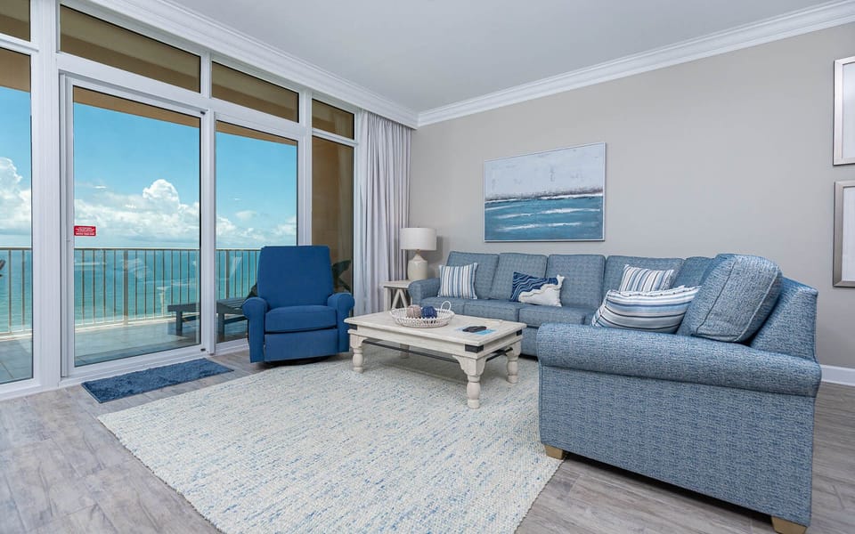 Relax on the cozy sofa with a queen sleeper in this inviting family room with breathtaking beachfront views