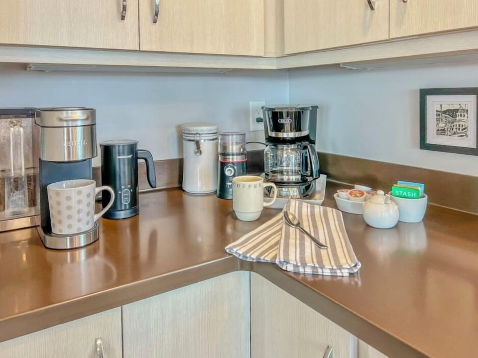 Sure, a coffee pot is a must but we've added a Keurig, a milk frother, and a grinder.