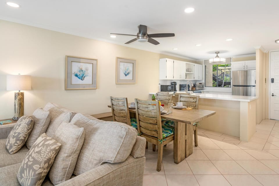 Open concept layout connects living room, dining area, and kitchen