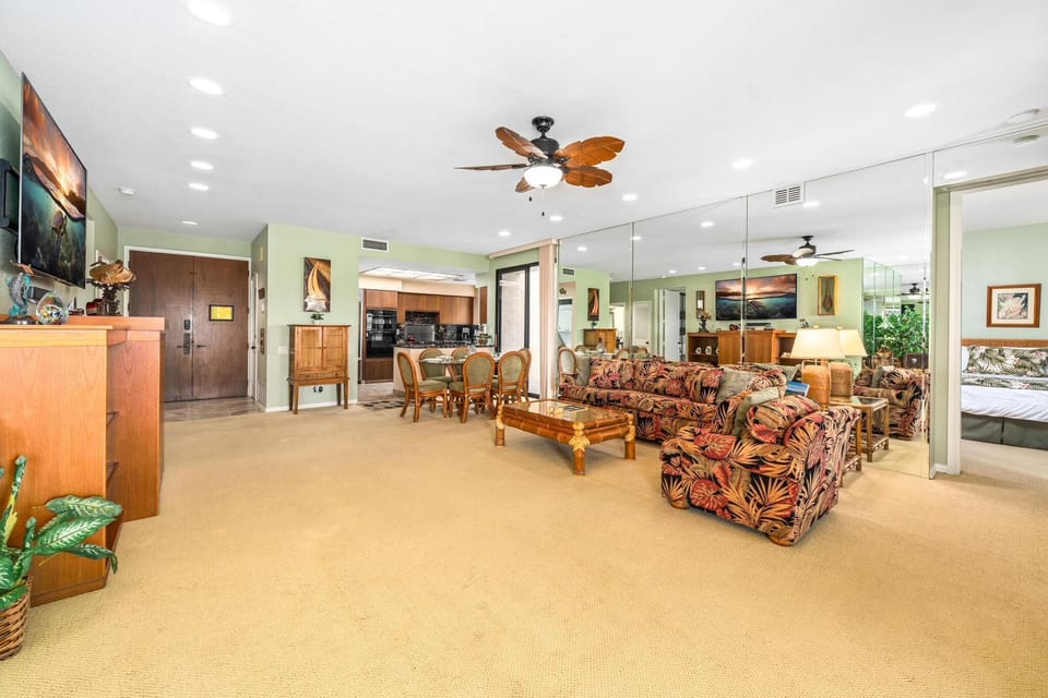 Open concept layout connects living room, dining, and kitchen