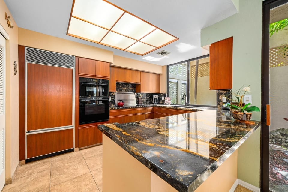 Full kitchen with granite countertops and modern appliances