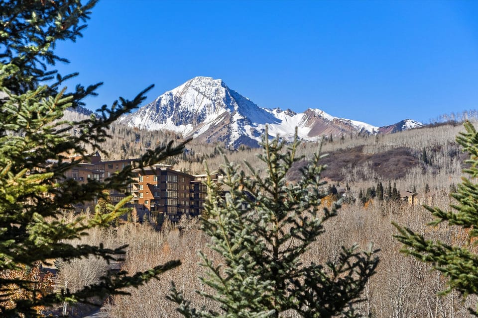 Wake up to breathtaking mountain vistas that frame your windows like a living masterpiece. You'll feel the crisp alpine air and endless blue skies calling you to adventure from this stunning mountain retreat.
