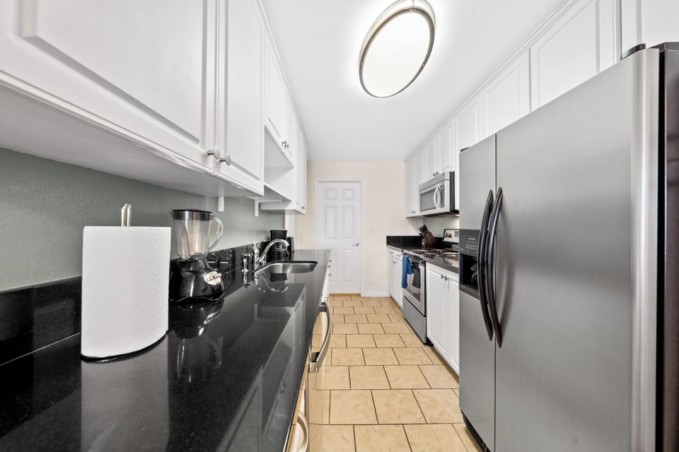 Fully equipped kitchen with modern appliances 