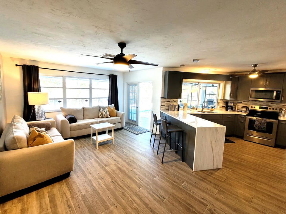 Living room 2 with door to patio and Kitchen