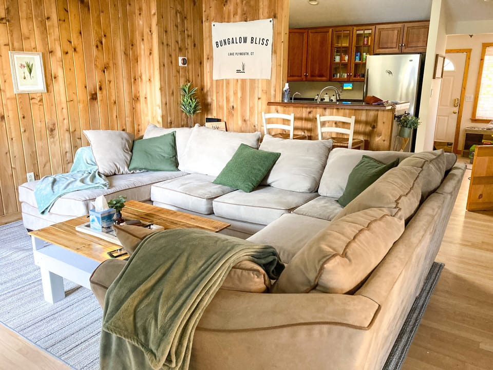 A cozy sectional to gather and enjoy the lakefront views provided by the lake