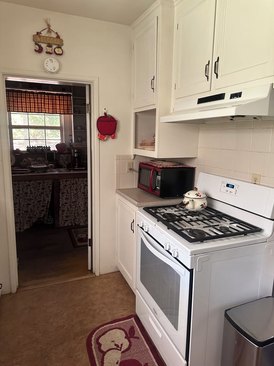Four burner stove with oven as well as microwave for quick on-the-go meals