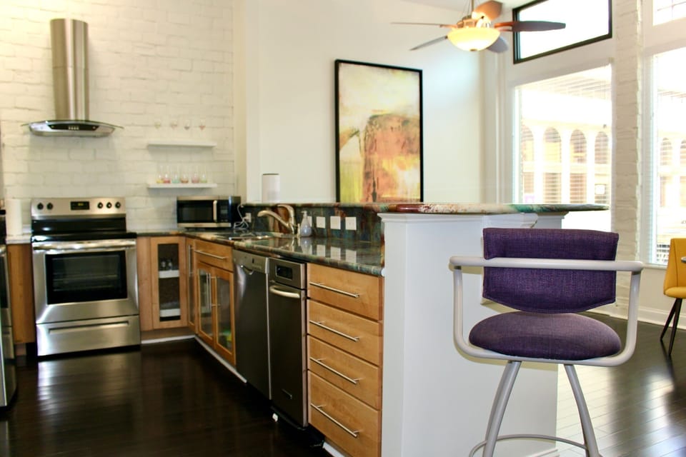 Open kitchen to living room/TV area.