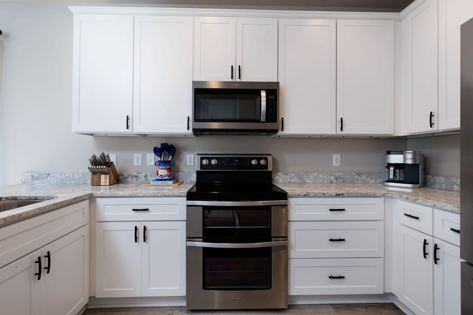 new stainless steel appliances, double oven,coffee maker, spices, utensils etc. 