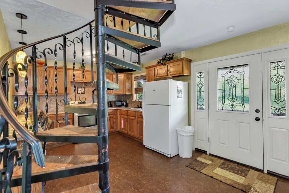 The really cool spiral staircase leads up to the second floor. There are also steps on the exterior of the cabin that lead to the upstairs as well. 
